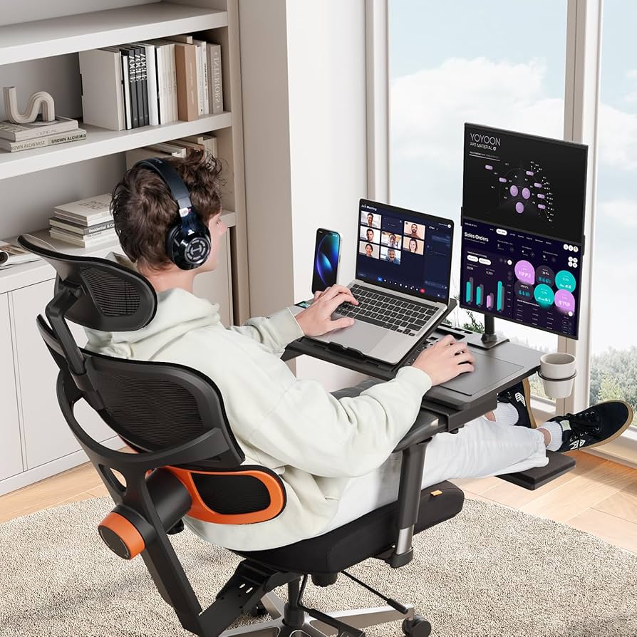 A tidy desk arranged with a laptop, external monitor and adjustable chair during a workspace review